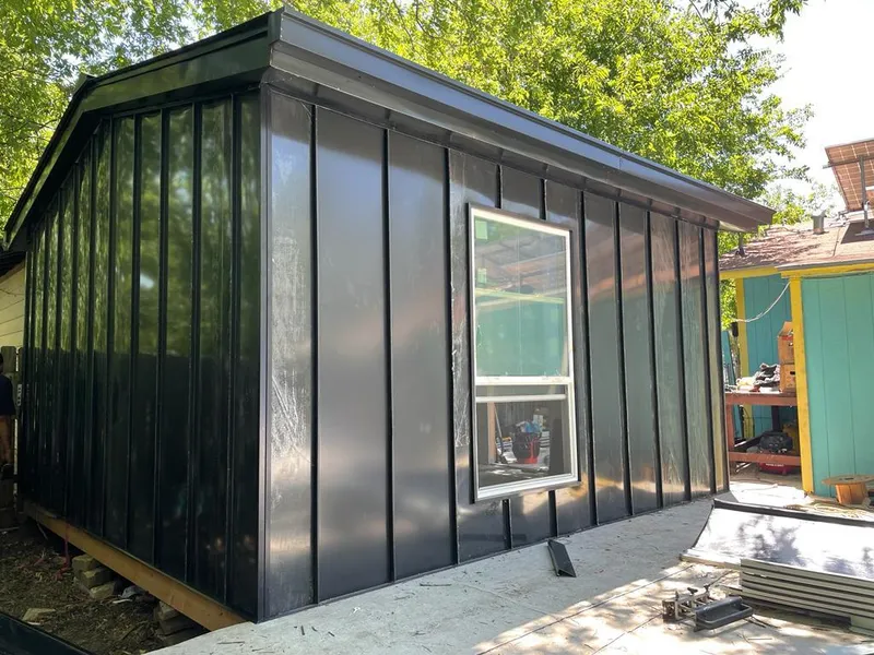 Black standing seam metal wall panels for Metal Roof Installation in Garrison