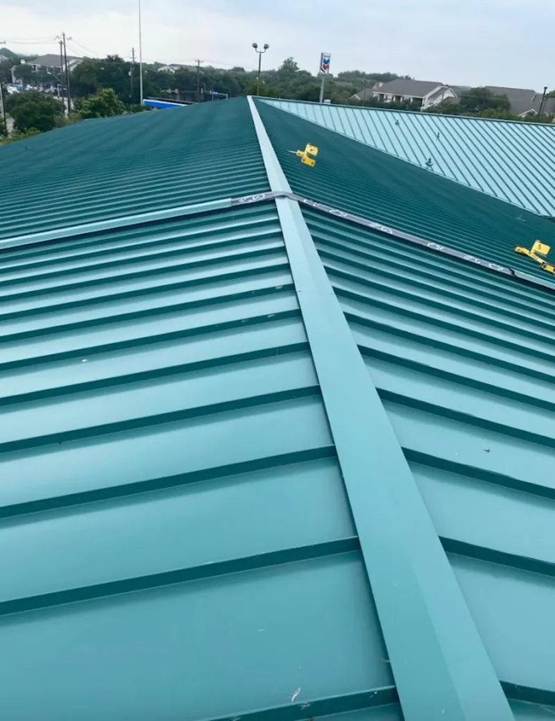 Green commercial metal roof ridge and valley for Metal Roof Repair in Garrison