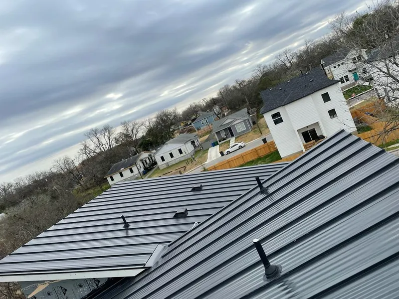 Standing seam metal roof panels with vents for Skylight Repair in Garrison